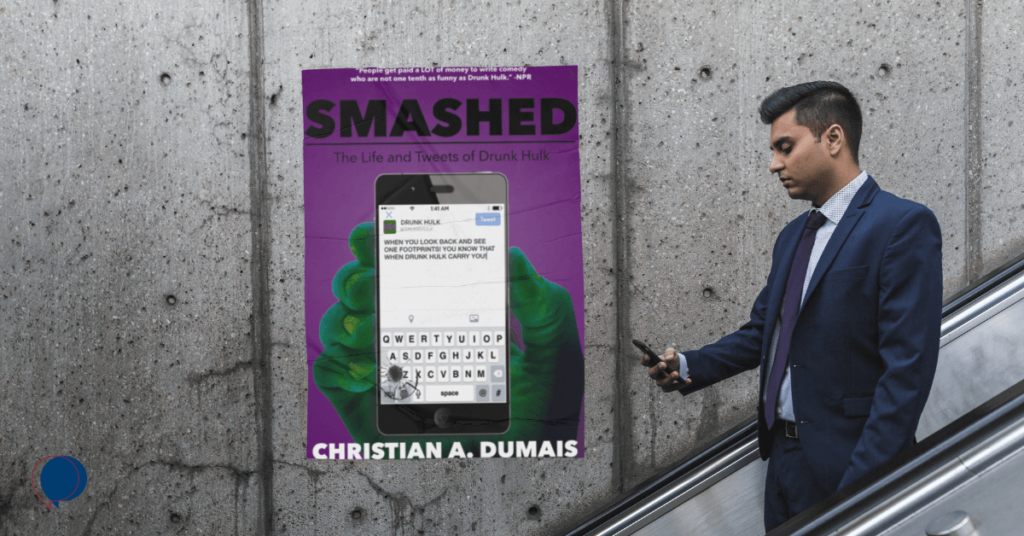 A man on an escalator using his phone with a poster of Smashed: The Life and Tweets of Drunk Hulk in the background.